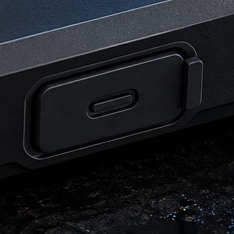 Close-up of the hinged cover over the USB-C port.